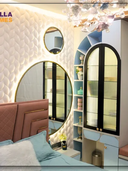 A view of the teenage girl's room, highlighting the elegant combination of the textured wall, circular mirrors, and the custom-designed vanity and display cabinet.