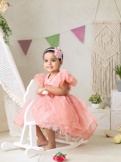 My boho-themed sessions use natural textures like macrame, wood, and greenery to create a calm and earthy setting that beautifully complements your child's simple joy.