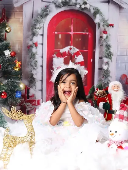 The pure excitement of Christmas captured in this little girl's surprised and happy expression.