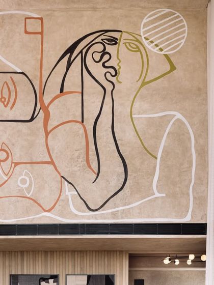 The upper portion of the mural, showcasing a pensive, abstract portrait that adds an emotional layer to the composition.