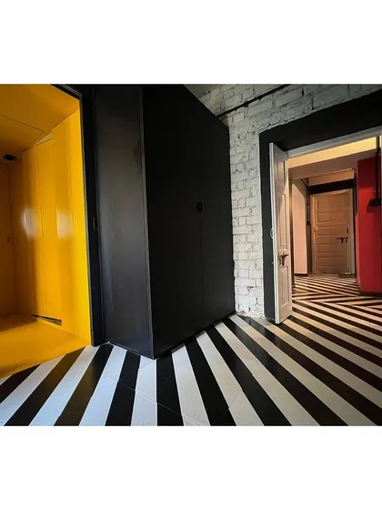 The interior of our CoLive @ TAS project, where we resurrected a dilapidated 1960s apartment. The design uses bold graphic flooring and color blocking to create a dynamic living space for the architects of our studio.