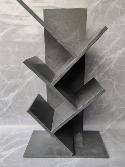 The grey cemented marble look gives this bookshelf a modern and industrial feel. It's a versatile piece that fits perfectly in a contemporary home or office setting.