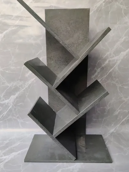 The grey cemented marble look gives this bookshelf a modern and industrial feel. It's a versatile piece that fits perfectly in a contemporary home or office setting.