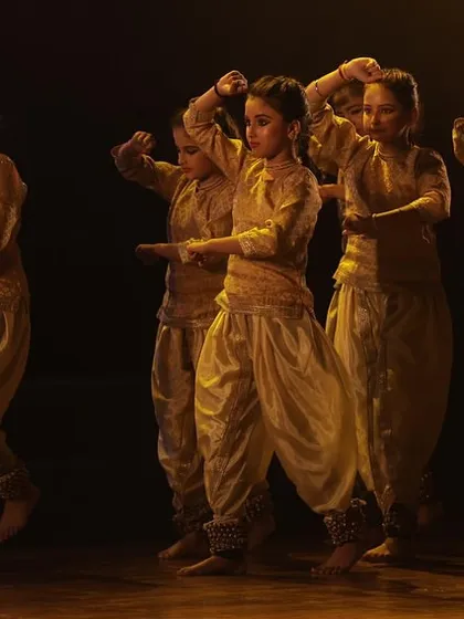 Our younger students performing a piece at Varshik Utsav 2024. We believe in giving our shishyas, even the youngest ones, the experience of performing on a grand stage.