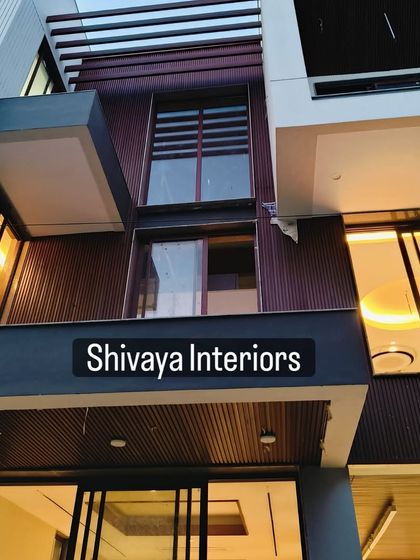 This is a closer look at the detailing on a modern facade project. You can see the clean lines of the dark brown cladding and how it integrates with the building's structural elements and window frames for a cohesive finish.