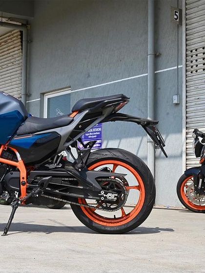 The old guard meets the new kid on the block. A Gen 1 KTM Duke 390, a classic choice for the track, parked next to the latest generation model.