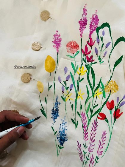 Another look at the minimalist garden painting. The variety of flowers, from tulips to lavender, creates a colorful and charming scene on the suit coat.