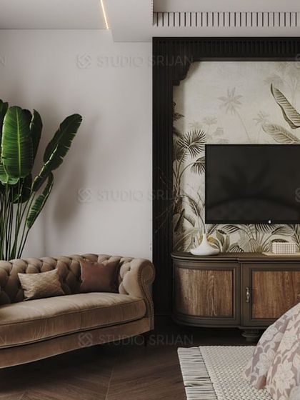 This view shows the seating area in the tropical-themed bedroom, with a classic, tufted loveseat and a rustic wooden TV console.