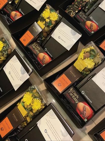 Inside the Codaemon employee appreciation boxes. We included a mix of practical items like a branded notebook and pen, along with treats and potpourri to create a multi-sensory experience.