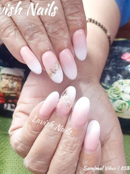 A soft baby boomer ombre on almond nails, with a delicate gold foil accent on one nail.