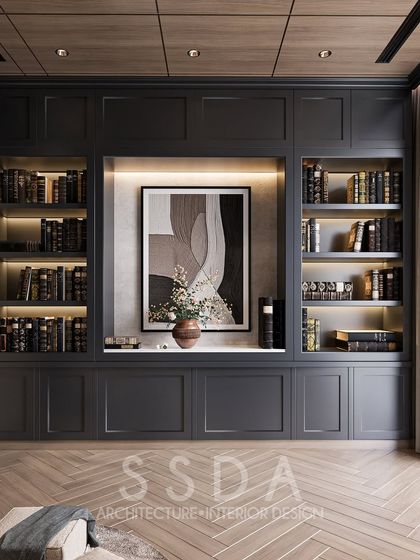 A view of the study concept, focusing on the built-in library with integrated lighting. The dark, moody color scheme creates a sophisticated and contemplative atmosphere.