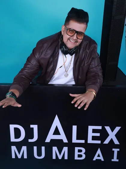 This is me in my element, commanding the console with my 'DJ Alex Mumbai' branding front and center. It's more than just playing tracks; it's about leading the vibe and creating moments that everyone remembers.