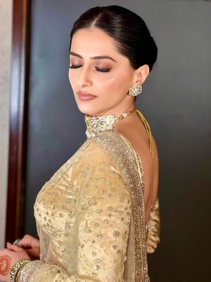 Elegant Updos & Floral Buns photo 10