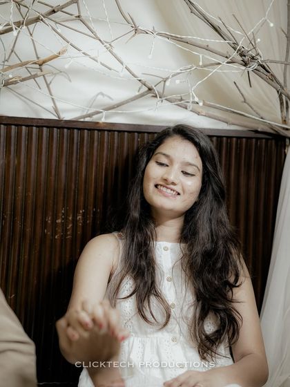 A close-up of the bride's joyful expression as she holds her partner's hand, capturing a moment of pure happiness.