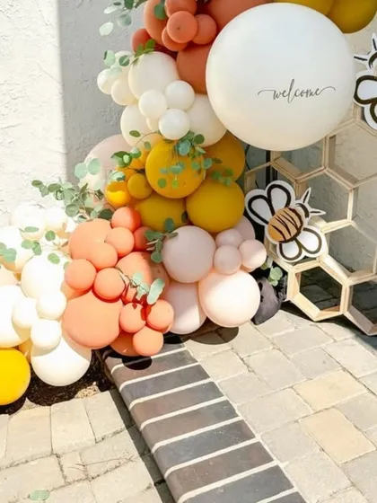 Detail of the honeycomb prop and "welcome" balloon, showcasing the small touches that make our themes special.