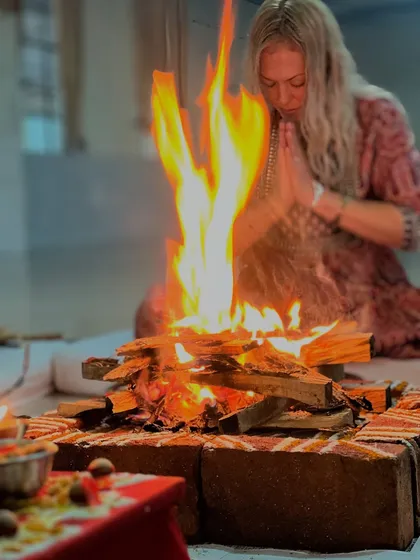 Our training begins by honoring ancient traditions. A student offers prayers during the Ganapati Homam, a fire ceremony to remove obstacles and create a positive energy for our shared spiritual journey.