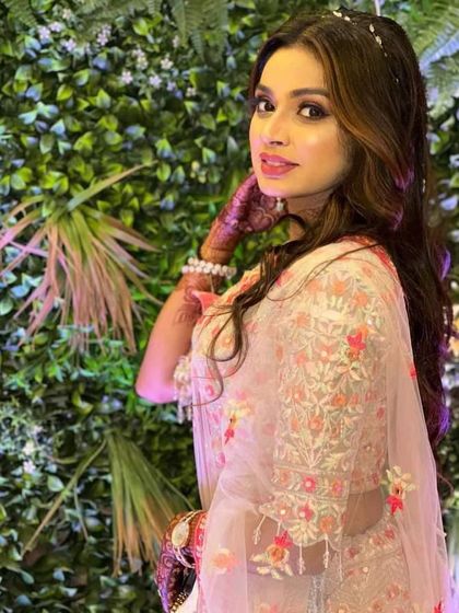 A beautiful client in a light pink floral lehenga. The delicate embroidery and soft color make this a very romantic rental choice.