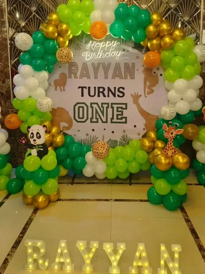 A straight-on view of Rayyan's jungle-themed first birthday backdrop.