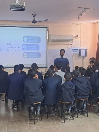 A trainer addresses a group of students in a computer lab. Our workshops are highly interactive, encouraging questions and active participation from all students.