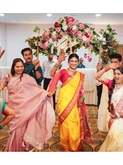 The bride's grand entrance, surrounded by the dancing and celebration of her friends and family.