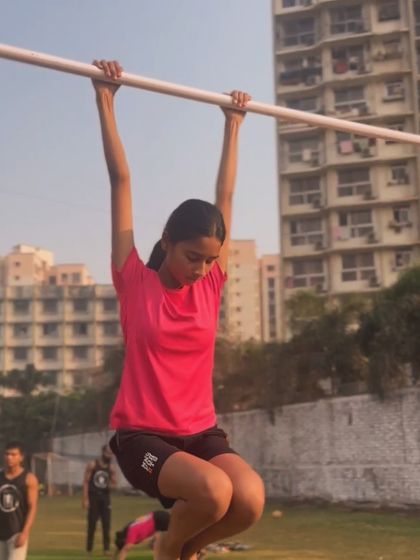 Working on grip strength with a dead hang. The morning sun and fresh air make for a perfect training session.
