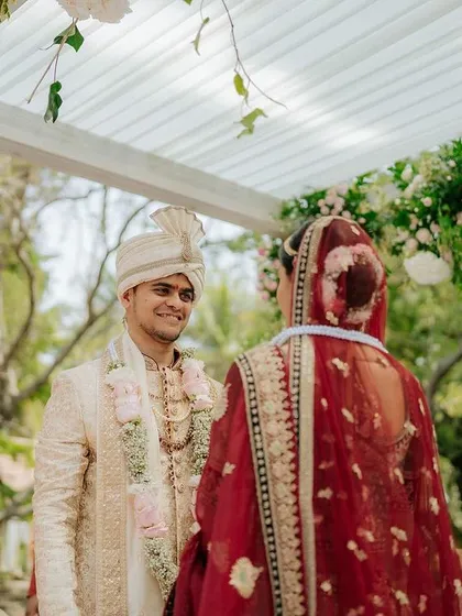 The groom's first look at his bride, his face full of love and admiration, a truly priceless moment.