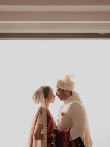 A beautiful silhouette of the couple during their first look, a private moment before the ceremonies begin. We help schedule these special photo opportunities.