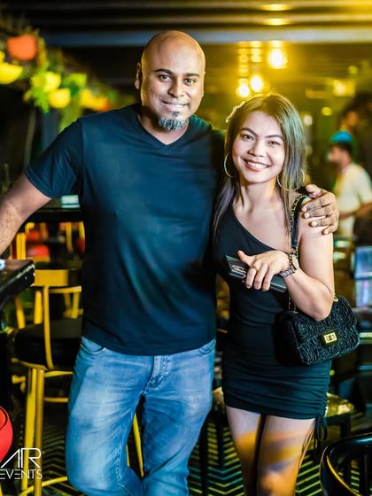 Posing with a guest at the bar. I make sure to be accessible and friendly with everyone who comes to my events.