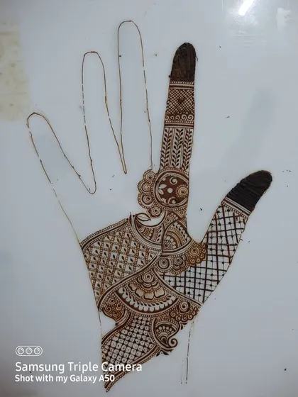 Some of my practice sheets where I experiment with different layouts and motifs. This helps me come up with new ideas for both bridal and party henna designs.