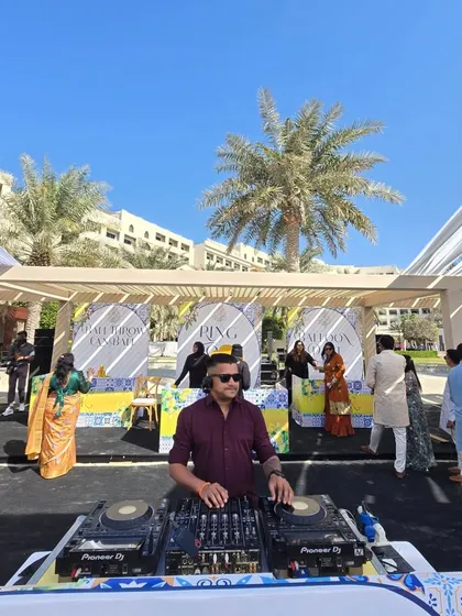 Playing for a daytime event in Bahrain. The guests are dressed in colorful traditional wear, enjoying the music under a beautiful canopy.