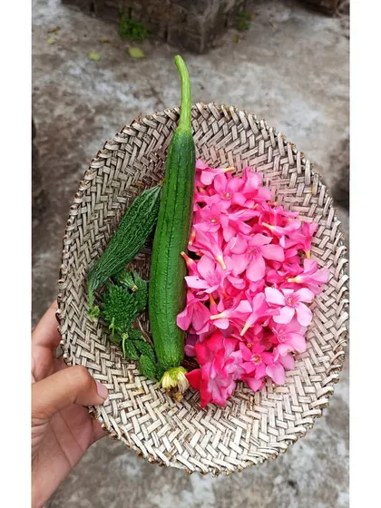 A small but beautiful harvest of sponge gourd, bitter gourd, and edible flowers. Even a small yield feels like a huge success.