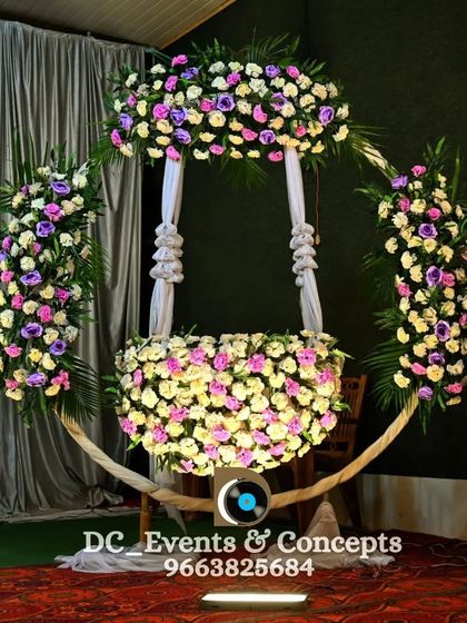 A unique and beautiful cradle decoration for a naming ceremony. The cradle is designed as a floral swing, creating a stunning and memorable centerpiece for the event.