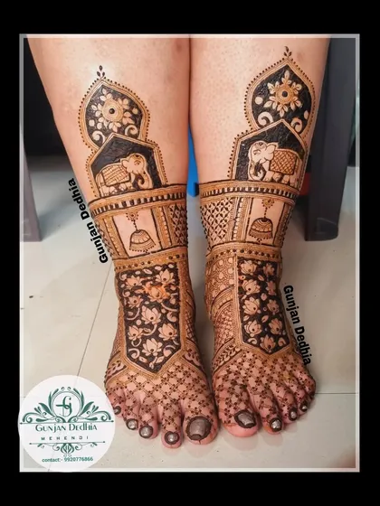 A beautiful bridal leg design featuring elephants, bells, and floral cutwork. The combination of different elements creates a rich and unique pattern.