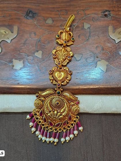 Another beautiful peacock motif maang tikka from my 92.5 silver collection. This one is finished with ruby-colored stones and delicate pearl drops.