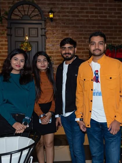 A group of friends enjoying the cozy, festive atmosphere.