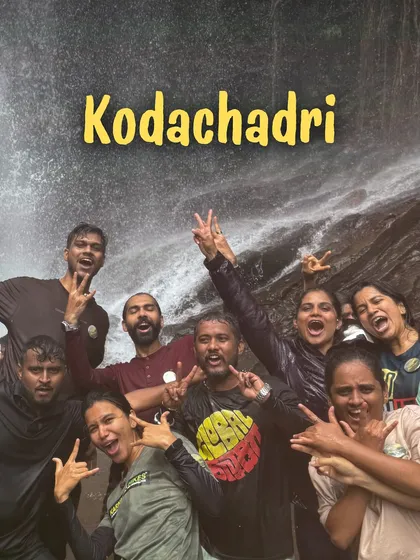 Pure excitement. Our group having the time of their lives at the base of a waterfall in Kodachadri.