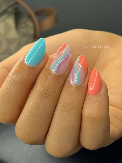 A set as pretty as a sunset. This design features colorful swirls of blue, purple, and coral with a silver glitter accent.