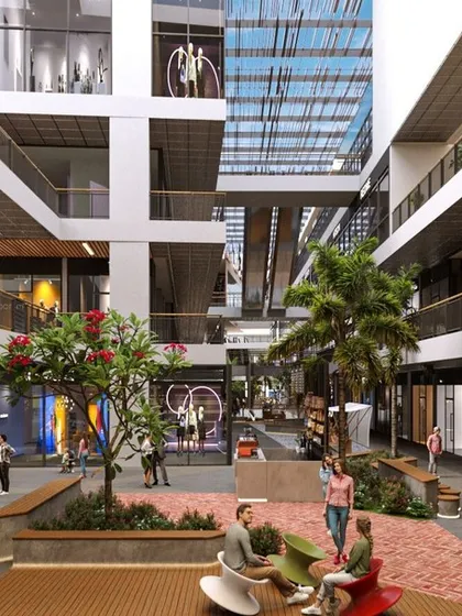 This render of the V'lante atrium highlights its role as a social hub. The combination of seating, greenery, and multi-level retail creates a vibrant and efficient urban environment that encourages people to linger.