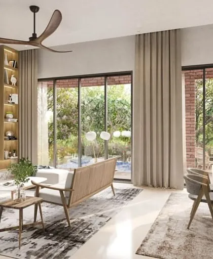 I design homes where the boundary between inside and outside is fluid and inviting. This living space at the Lake Forest Hill development uses large windows to fill the interior with natural light and connect residents to the surrounding landscape.