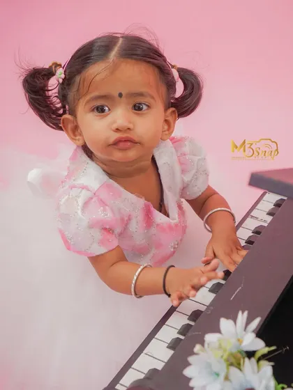This little girl is getting serious about her music. I love capturing the full range of expressions, from happy smiles to focused concentration.