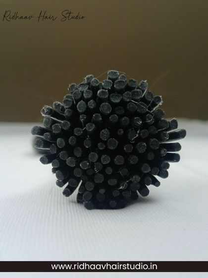 A close-up of the keratin tips on our I-Tip wavy extensions, which are designed for durability and a secure micro-link application.