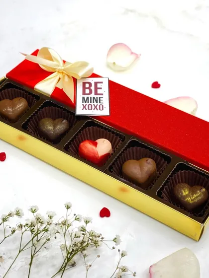 A beautifully packaged box of my Valentine's Day bonbons, complete with a "Be Mine" tag. It's all in the details.