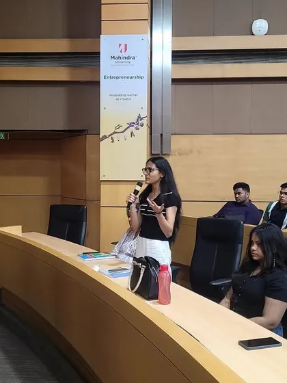 A law student poses a question during the interactive Q&A session at Mahindra University. We encourage active participation and critical thinking in all our educational outreach initiatives.