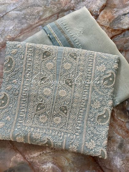 Another angle of the laid-out suit, showing the texture of the silk chanderi fabric.