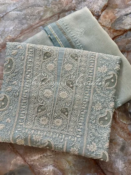 Another angle of the laid-out suit, showing the texture of the silk chanderi fabric.