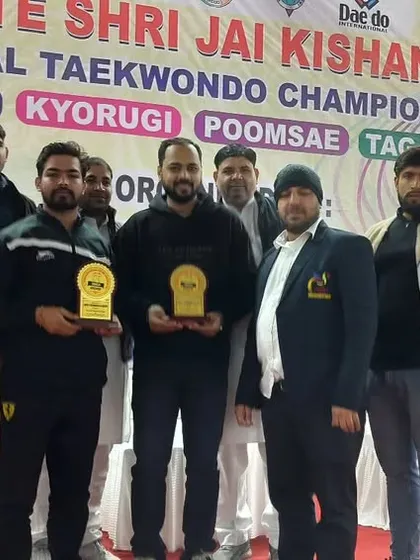 A moment of recognition for the coaches at the Memorial Taekwondo Championship.