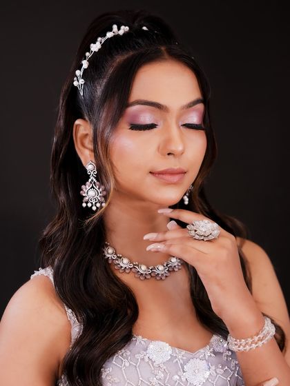 The closed-eye shot highlights the delicate pink and lavender tones on the eyelid. You will learn to create soft, ethereal eye looks.