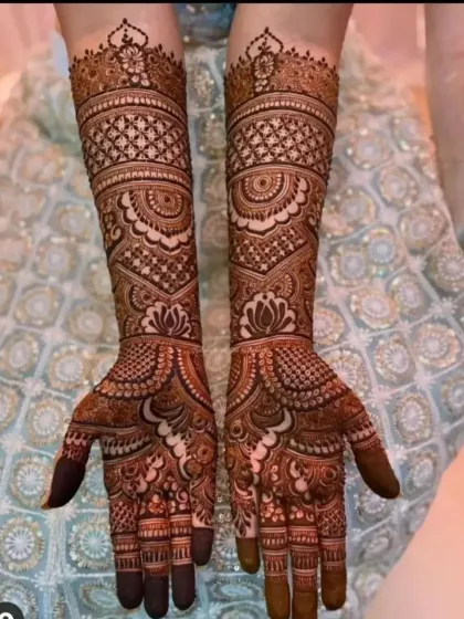 A rich and dense bridal design with lotus motifs and detailed check patterns. The full coverage ensures a grand and traditional appearance.