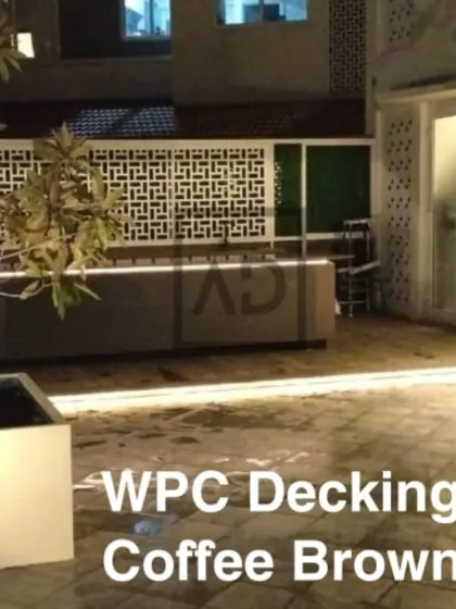 This view shows the expanse of the WPC deck, creating a large, usable outdoor area perfect for entertaining. The material is splinter-free and safe for bare feet.