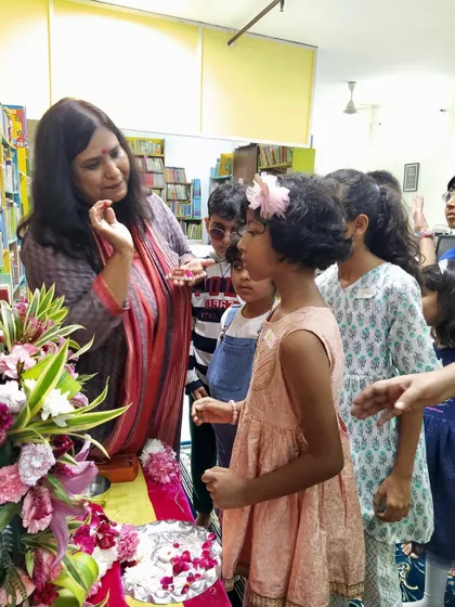 A close-up moment of interaction during the Ganesha pooja. I love explaining the meaning behind the rituals to the curious young minds.
